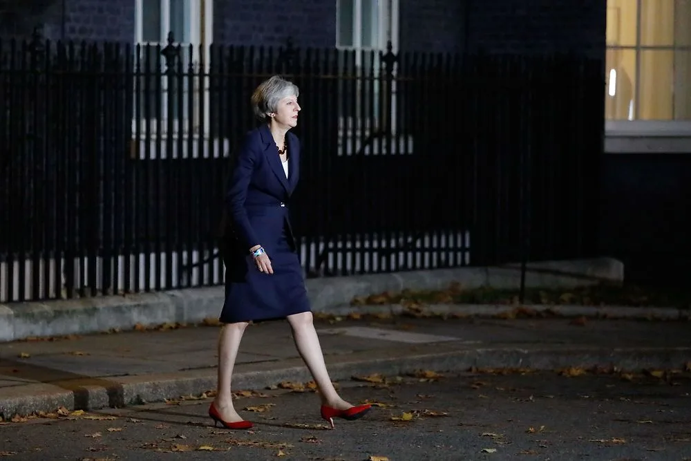 Theresa May survived the vote of confidence, vows to continue… something