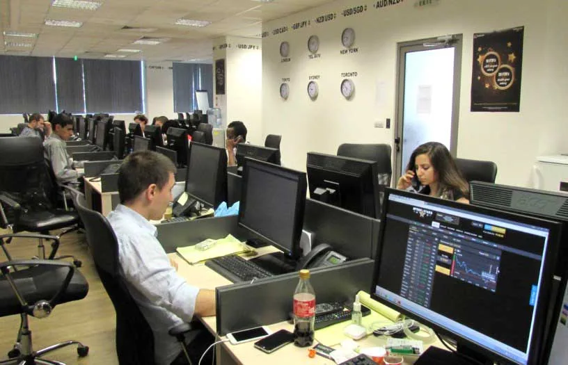 The website of OptionStars.com can be seen on a screen in this 2015 photo from one of Gal Barak's call centers. Funds from the fraudulent binary trading platform would later pass through Connectum accounts. (Facebook, E&G Finances)