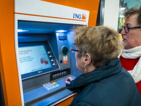 ING annual profit halved to 2.5 billion