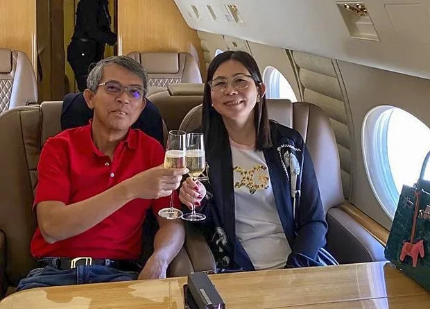 Ing Bun Hoaw, former Cambodian secretary of state for transport, and his wife Heng Sokha aboard a luxury charter jet at an undisclosed location June 20, 2021.